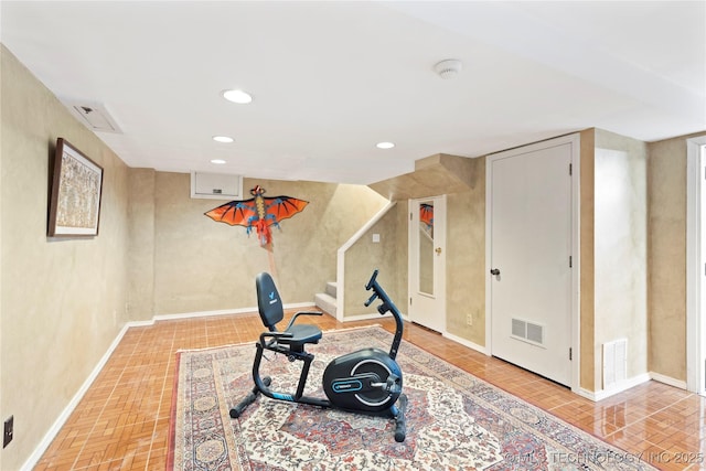 workout area with parquet flooring