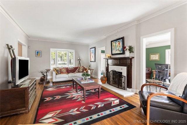 living room with wood-type flooring and crown molding