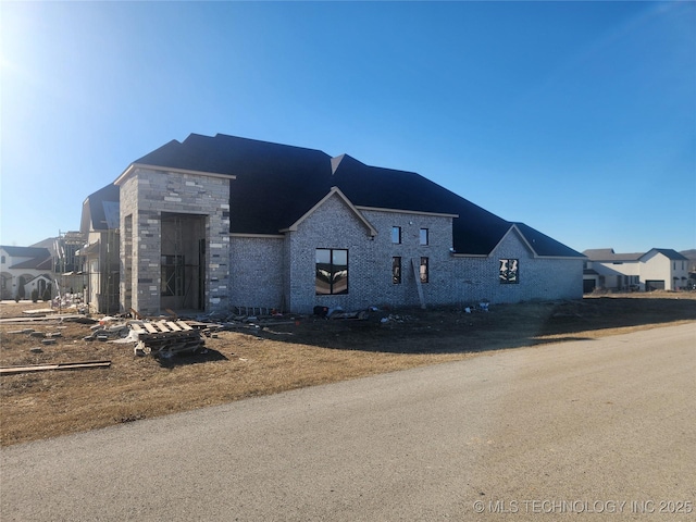 view of front of home with stone siding