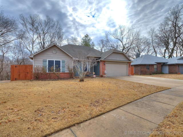 ranch-style house with a garage and a front yard