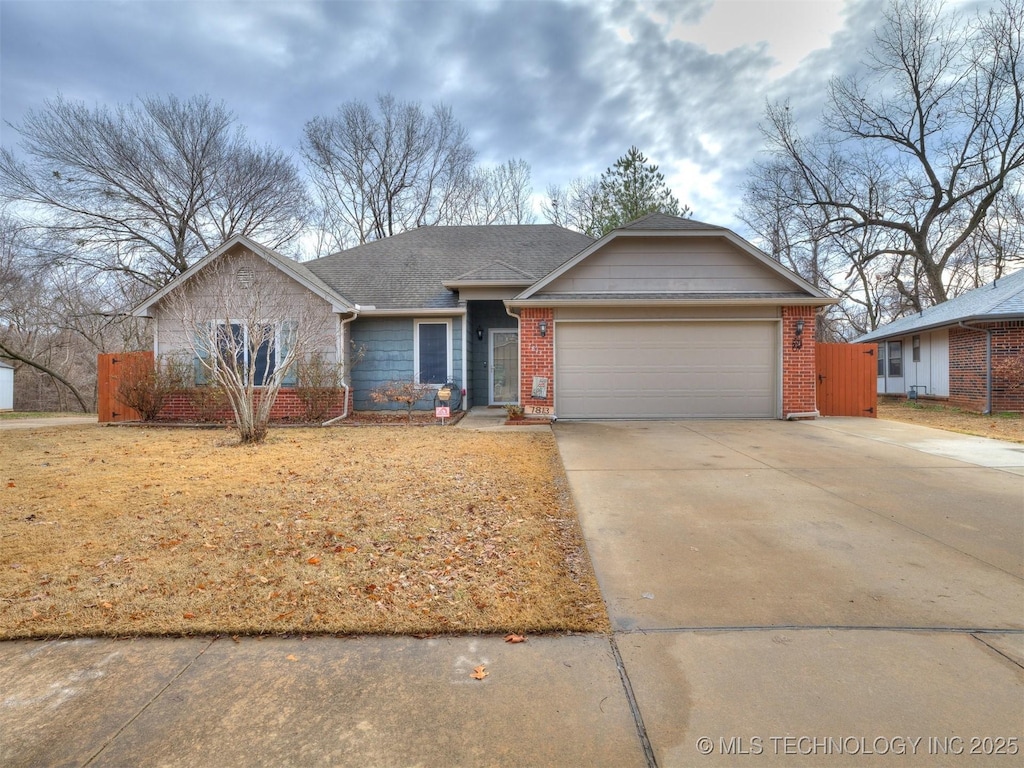 ranch-style home featuring a garage