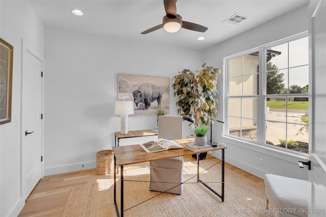 office space with ceiling fan and light hardwood / wood-style floors