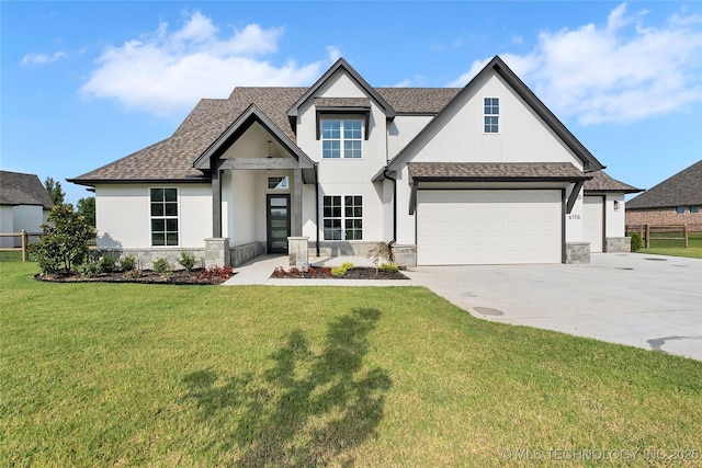 view of front facade with a garage and a front yard