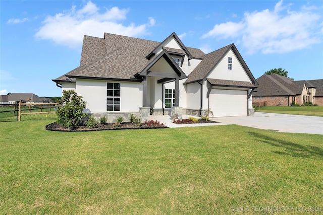 view of front of property featuring a garage and a front lawn