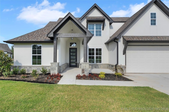 view of front facade with a garage and a front lawn