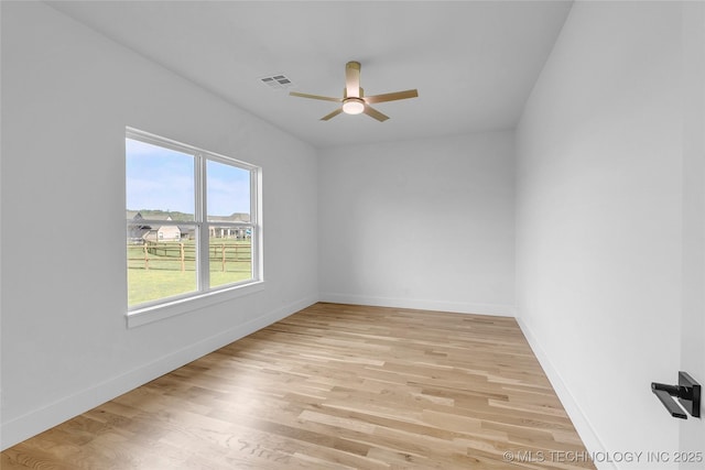 spare room with ceiling fan and light hardwood / wood-style flooring