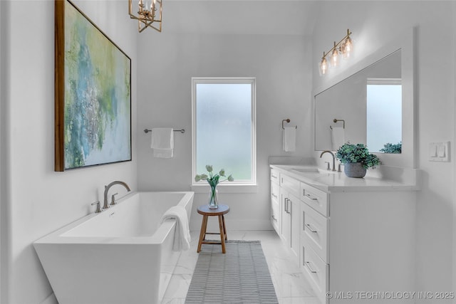 bathroom with vanity and a bathing tub