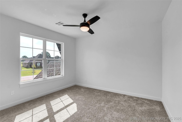 unfurnished room featuring ceiling fan and light colored carpet