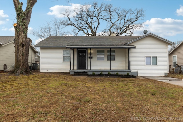 view of front of property with covered porch and a front yard