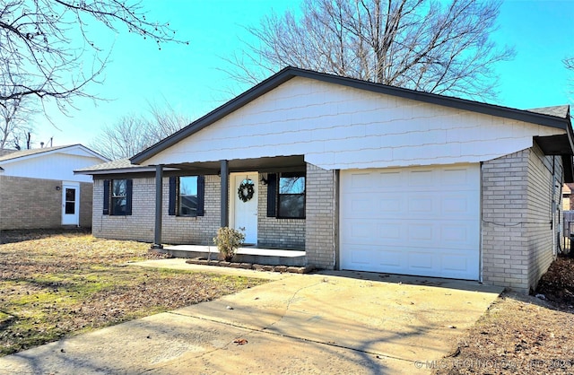 single story home featuring a porch and a garage