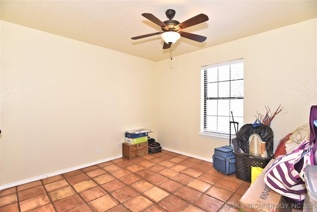 miscellaneous room with ceiling fan and tile patterned floors