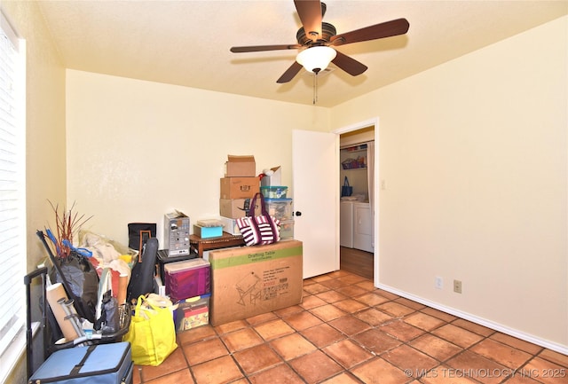 unfurnished room with ceiling fan and washer and dryer