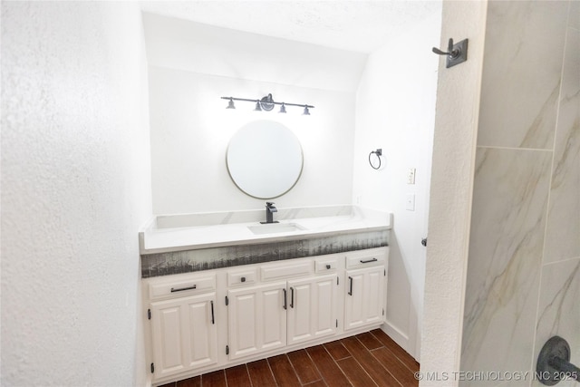 bathroom featuring wood finish floors and vanity