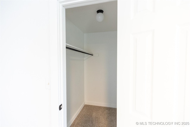 7850 S Park Ave, Broken Arrow, OK 74011 - walk in closet featuring carpet