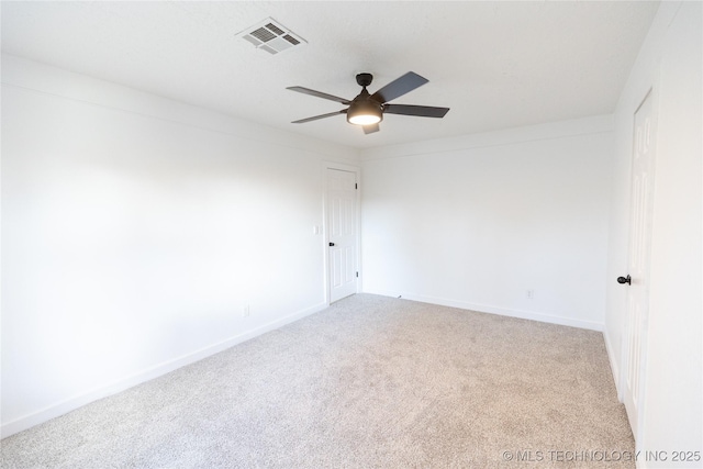 unfurnished room with ceiling fan and light carpet