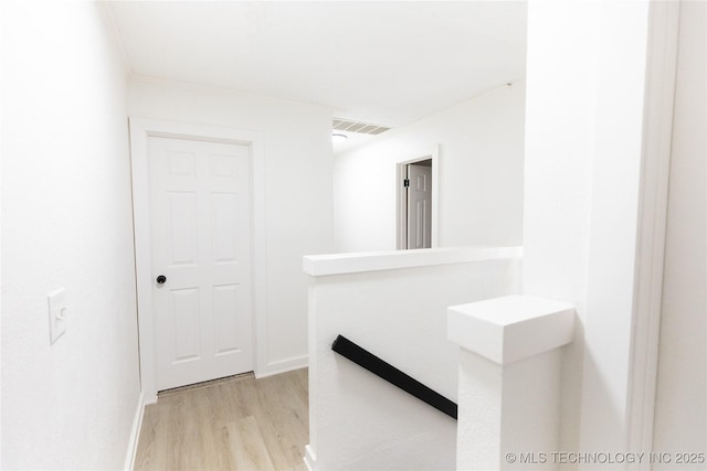 corridor featuring light hardwood / wood-style flooring