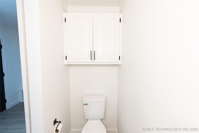 7850 S Park Ave, Broken Arrow, OK 74011 - bathroom featuring toilet and wood finished floors