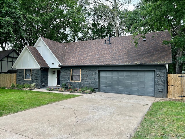 7850 S Park Ave, Broken Arrow, OK 74011 - view of front of house featuring stone siding, a shingled roof, driveway, and a garage