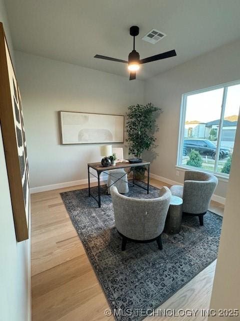 office area with hardwood / wood-style floors and ceiling fan