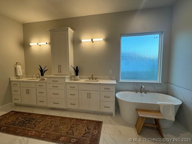 bathroom with vanity and a bathing tub