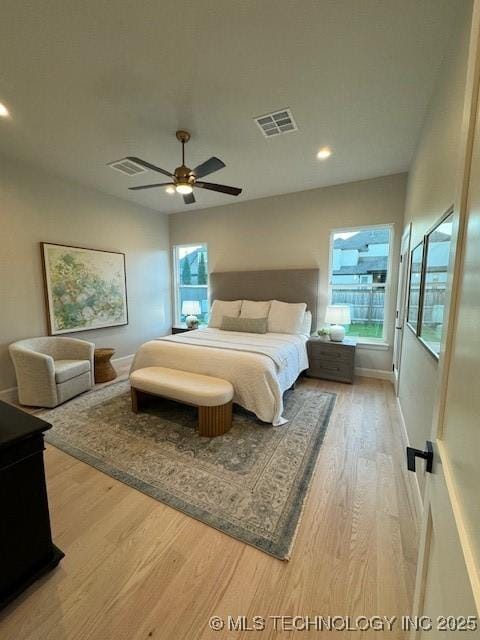 bedroom with hardwood / wood-style flooring and ceiling fan