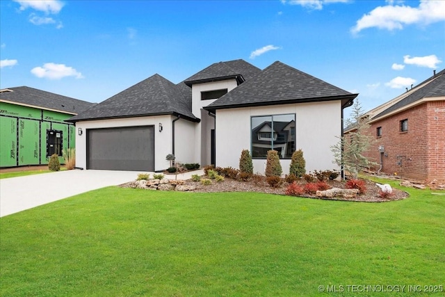 view of front of property with a garage and a front yard