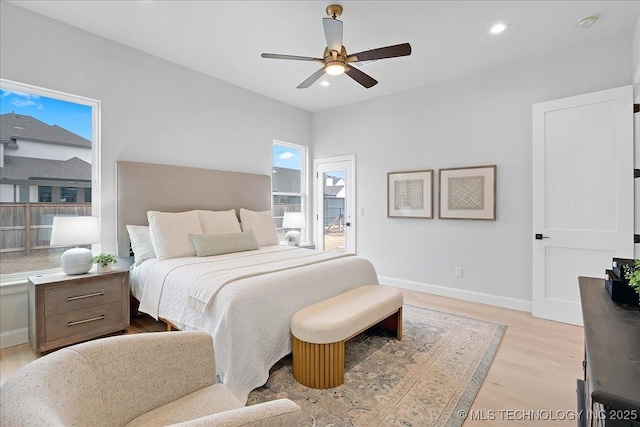 bedroom with ceiling fan and light hardwood / wood-style floors