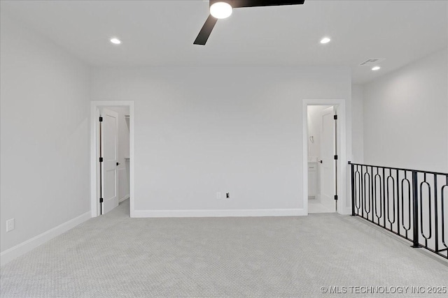 carpeted empty room with ceiling fan