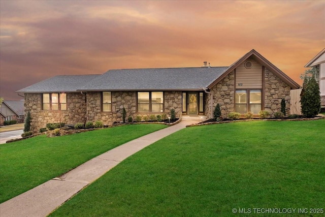 view of front of property with a lawn