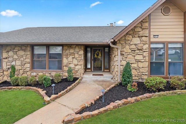 entrance to property with a yard