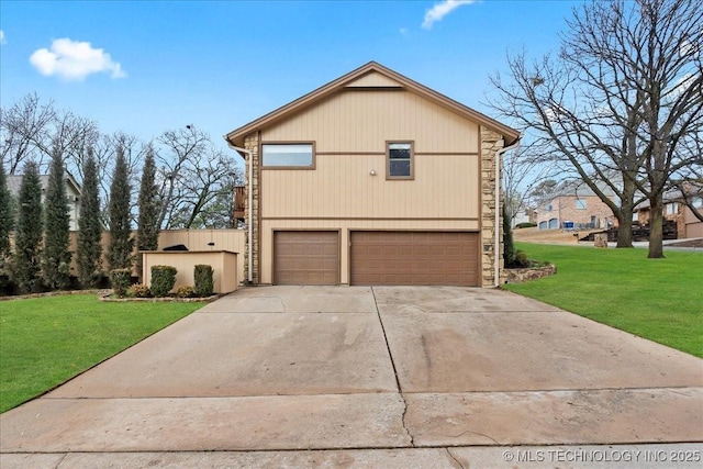 view of front of home featuring a garage and a front lawn