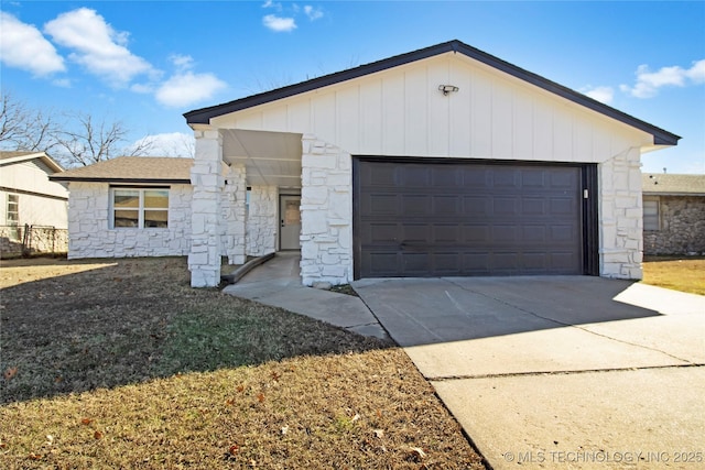 view of front of home with a garage and an outdoor structure