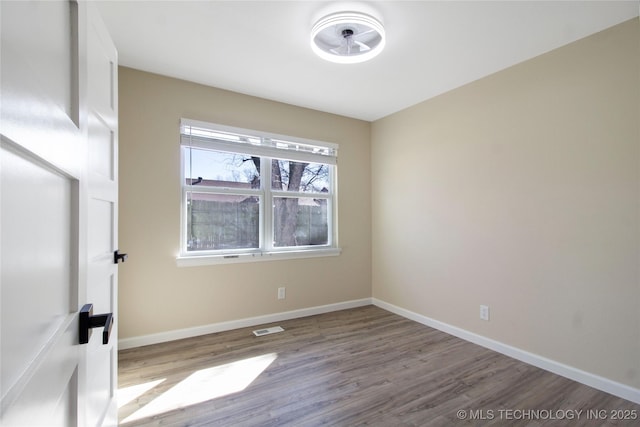 unfurnished room with light wood-type flooring