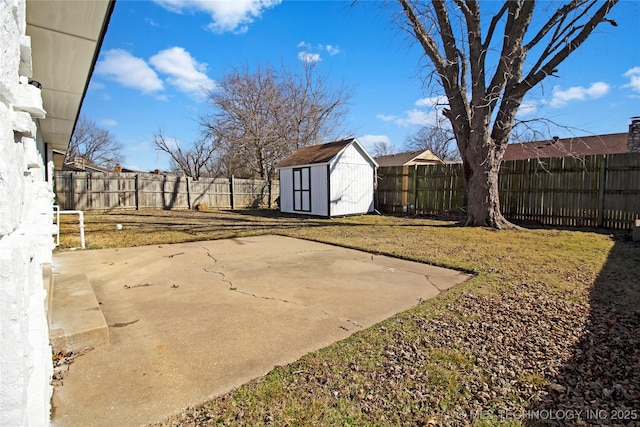 view of yard featuring a storage unit and a patio