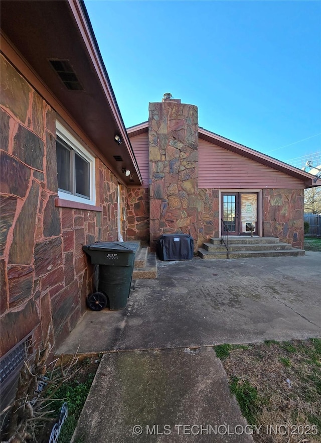 back of house with a patio area