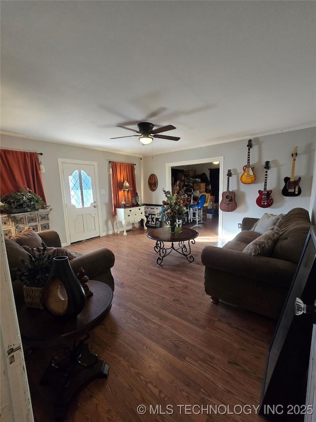 living room featuring wood-type flooring and ceiling fan