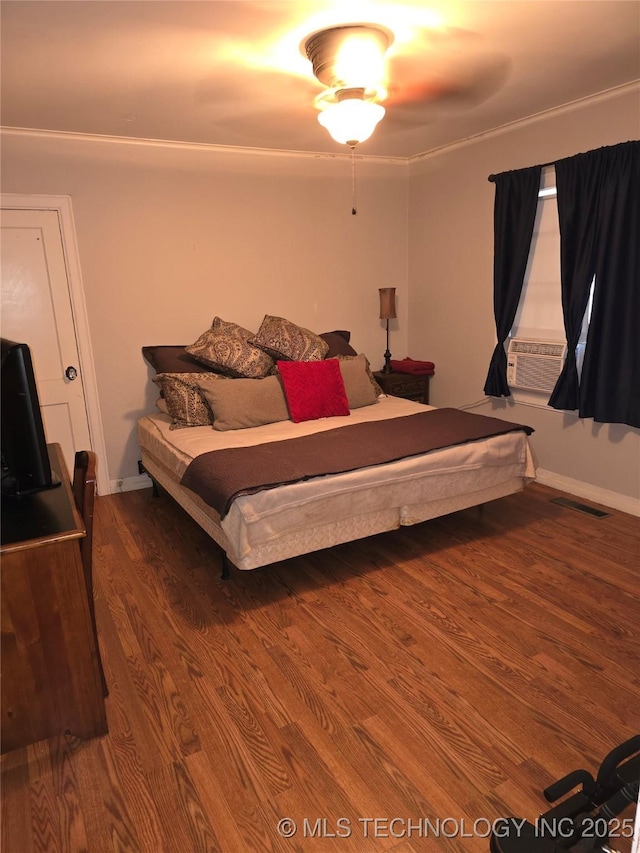 bedroom with hardwood / wood-style flooring