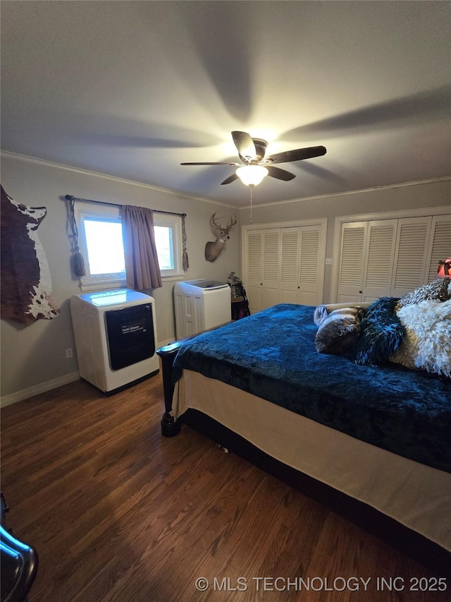 bedroom with multiple closets, ceiling fan, and dark hardwood / wood-style flooring