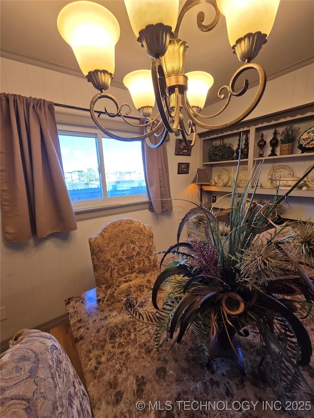 dining area featuring a notable chandelier