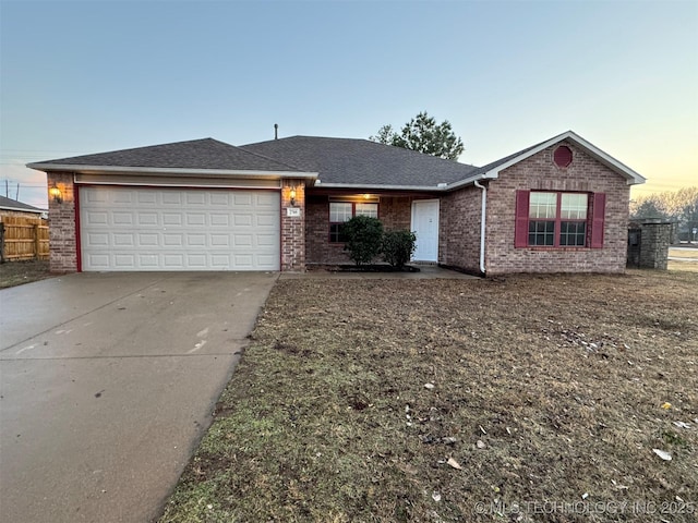 single story home featuring a garage