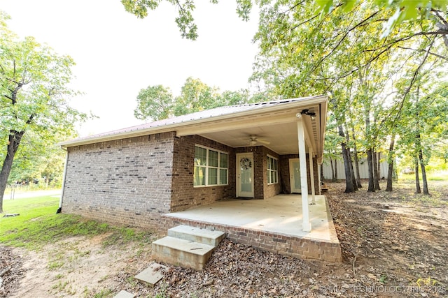 exterior space with a patio and ceiling fan