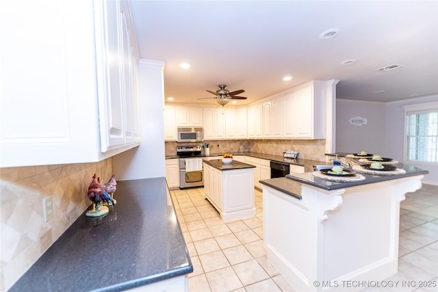 kitchen with light tile patterned floors, white cabinetry, backsplash, stainless steel appliances, and kitchen peninsula