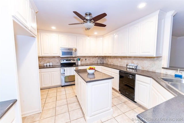 kitchen featuring white cabinetry and appliances with stainless steel finishes