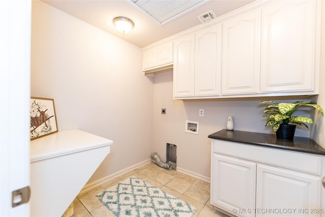 laundry area featuring cabinets, light tile patterned flooring, hookup for a washing machine, and hookup for an electric dryer