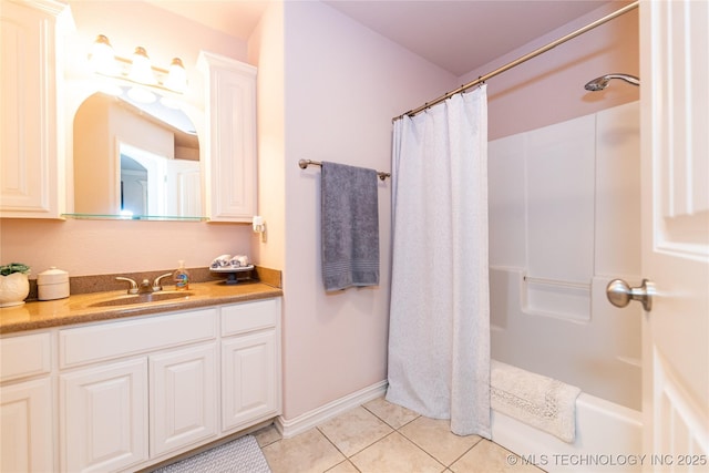 bathroom featuring tile patterned flooring and vanity