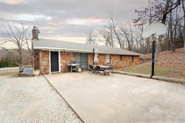 rear view of property featuring a patio