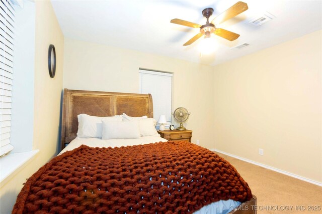 bedroom with ceiling fan and carpet