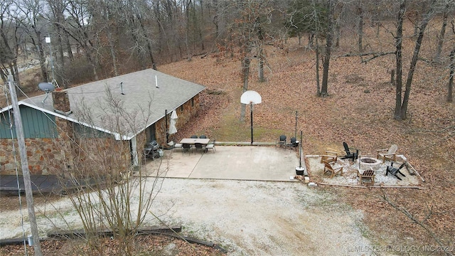 exterior space with a patio area and a fire pit