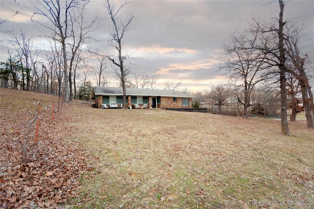 ranch-style house featuring a yard