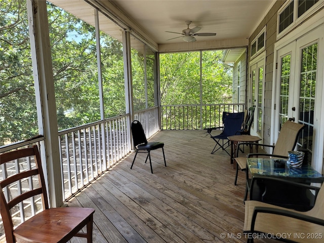 sunroom featuring ceiling fan